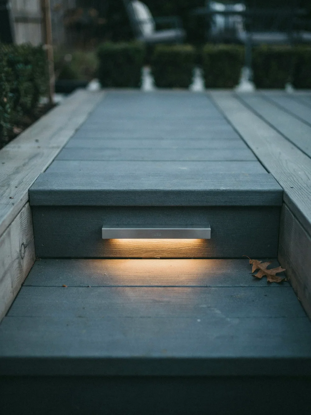 Flush-Mount Riser Panels That Disappear Into the Step