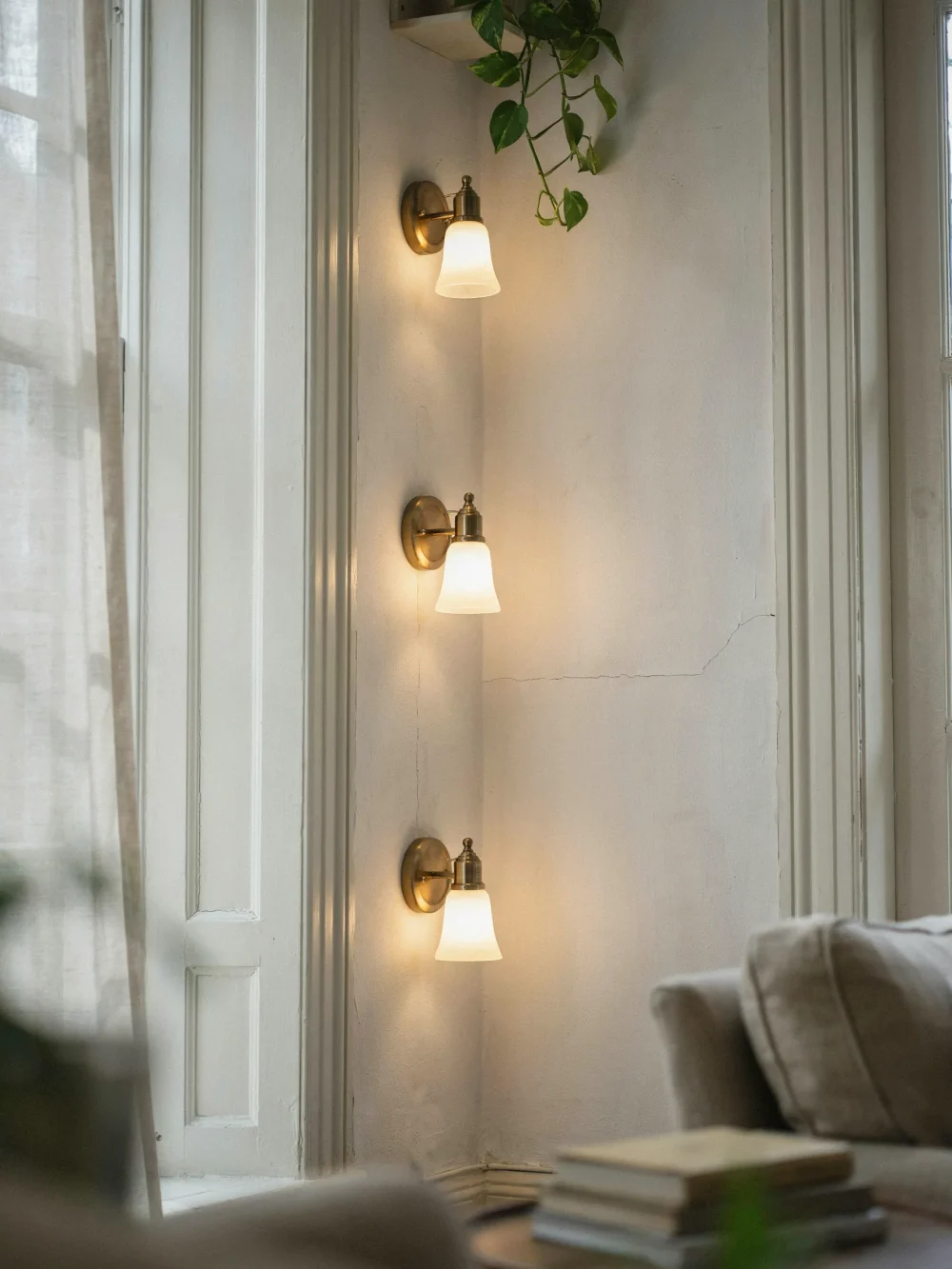 Three Sconces in a Vertical Column