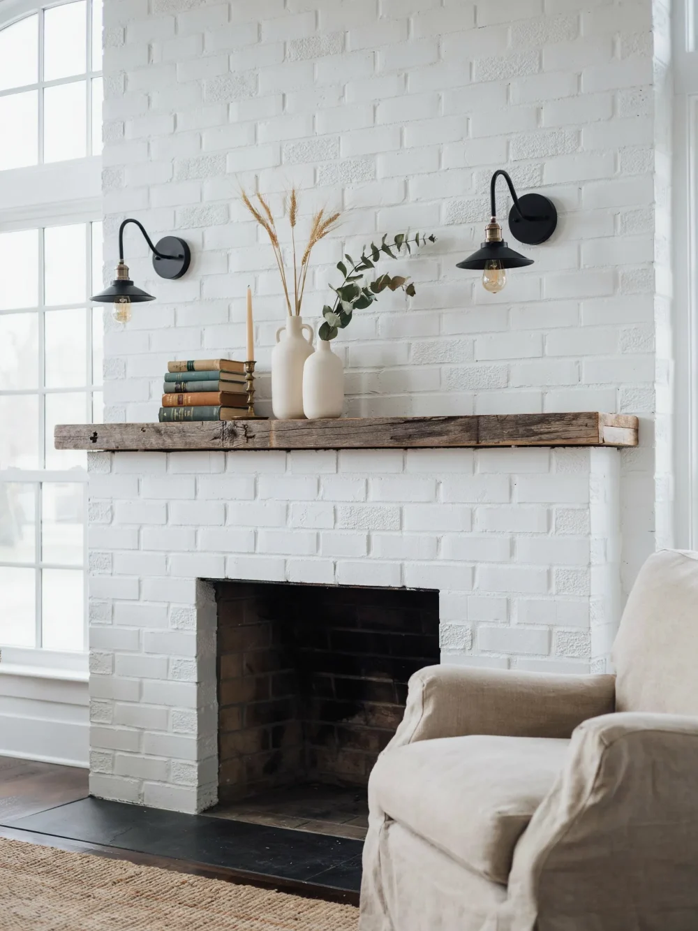 Gooseneck Arm Sconces Flanking a Fireplace