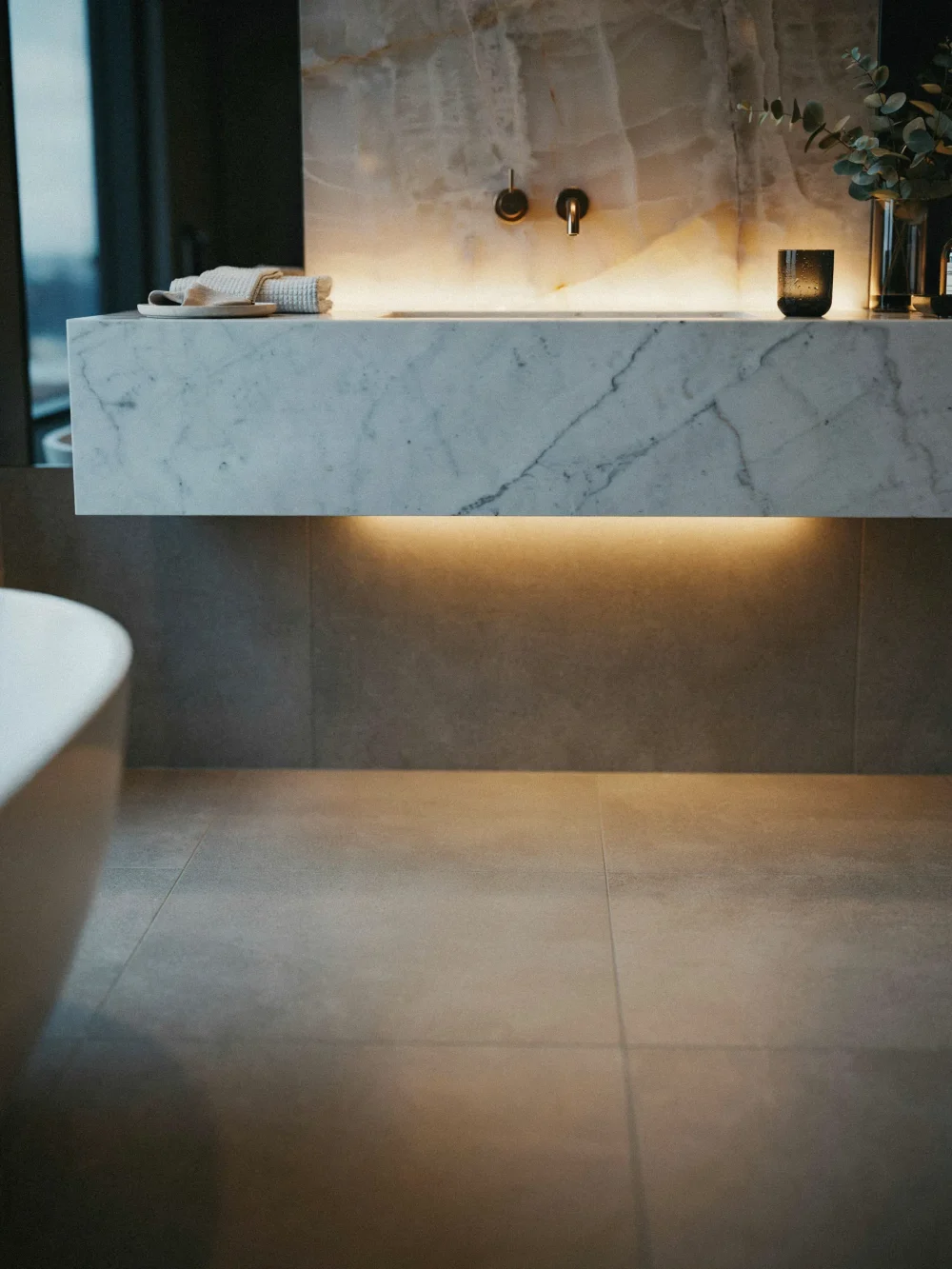Cantilevered Quartz Vanity With Under-Counter LED Strip
