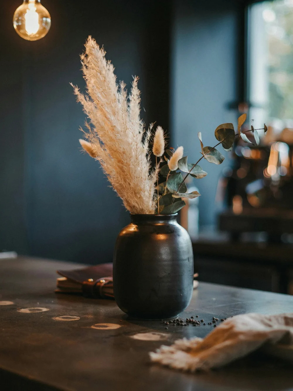 Dried Botanicals in a Dark Ceramic Vase